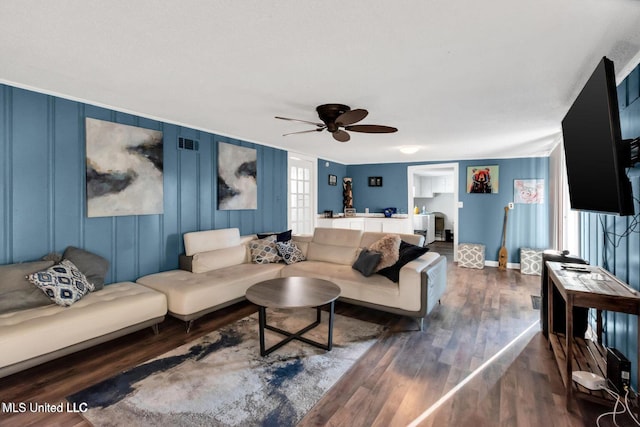 1264 28th St, Gulfport, MS 39501 - living area with a ceiling fan, dark wood-style floors, and baseboards