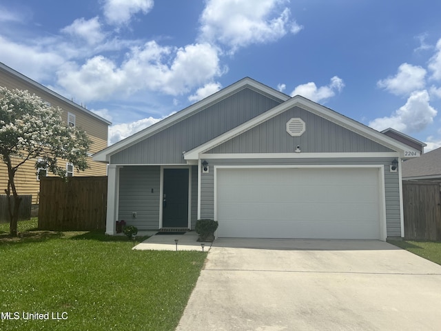 2204 Magazine St, Ocean Springs, MS 39564 - view of front of house with concrete driveway and a garage