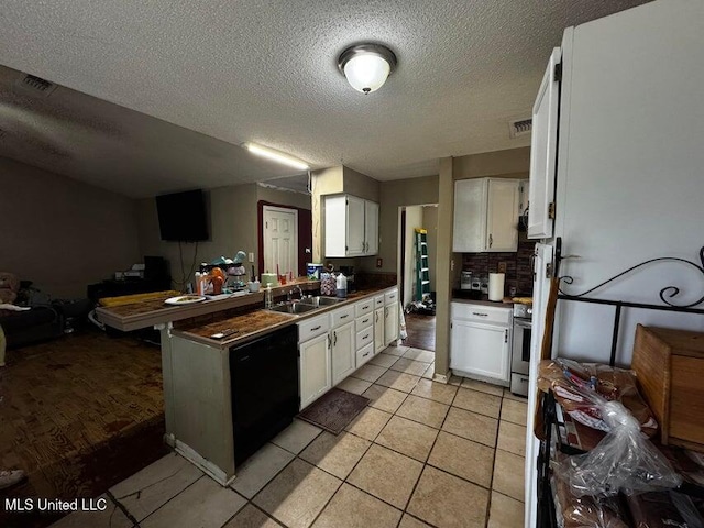 53 Flagstaff St, Lumberton, MS 39455 - kitchen with open floor plan, black dishwasher, white cabinets, dark countertops, and a textured ceiling