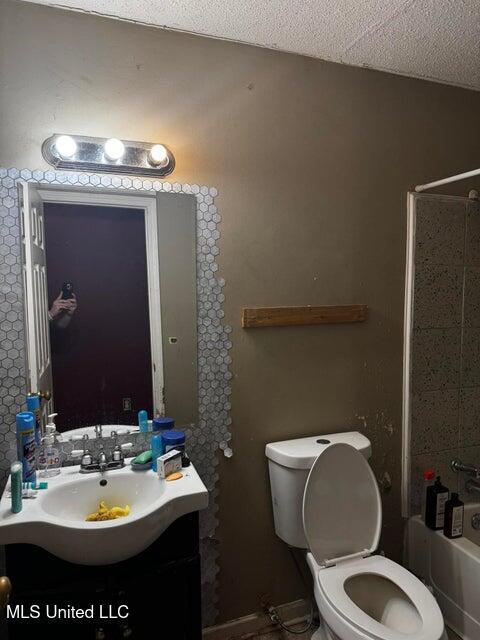 53 Flagstaff St, Lumberton, MS 39455 - bathroom featuring vanity, shower / bath combination, and a textured ceiling