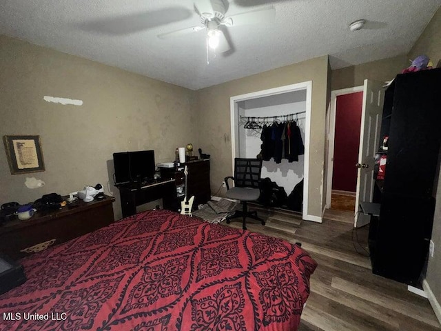 53 Flagstaff St, Lumberton, MS 39455 - bedroom with wood finished floors, a ceiling fan, and a textured ceiling