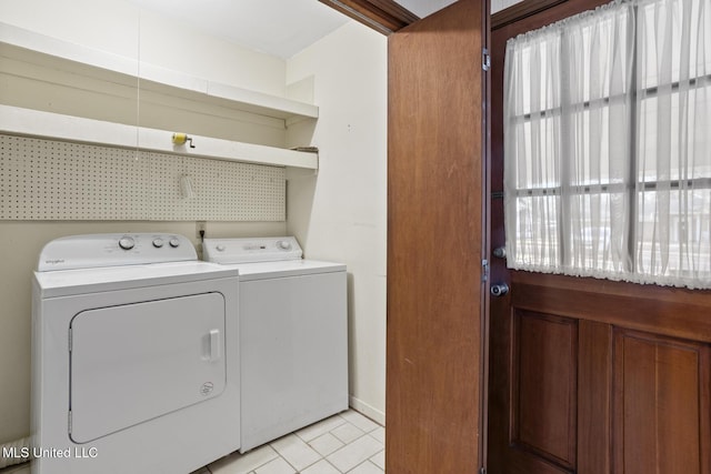 clothes washing area featuring laundry area and washer and dryer