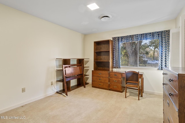 home office featuring light carpet and baseboards