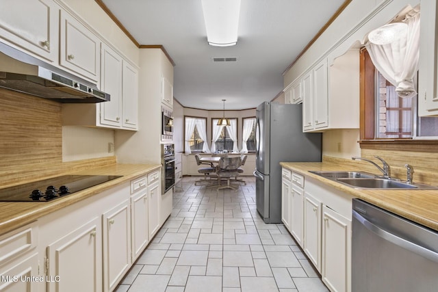 kitchen with stainless steel appliances, visible vents, white cabinets, light countertops, and hanging light fixtures