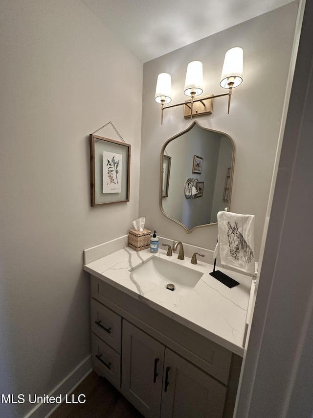 bathroom featuring vanity and baseboards