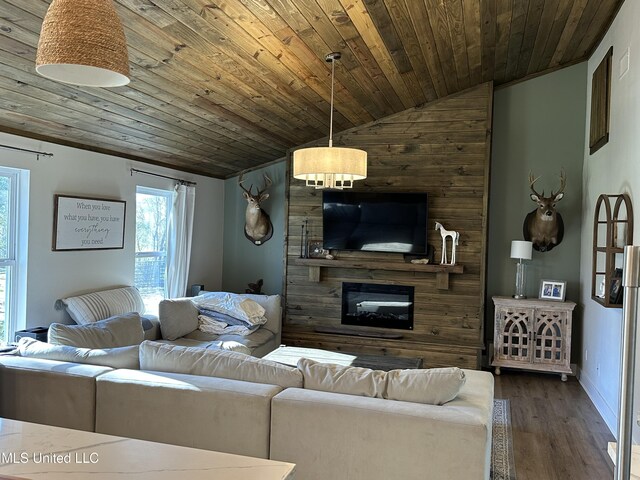 living area with a large fireplace, baseboards, wood ceiling, dark wood-style flooring, and vaulted ceiling