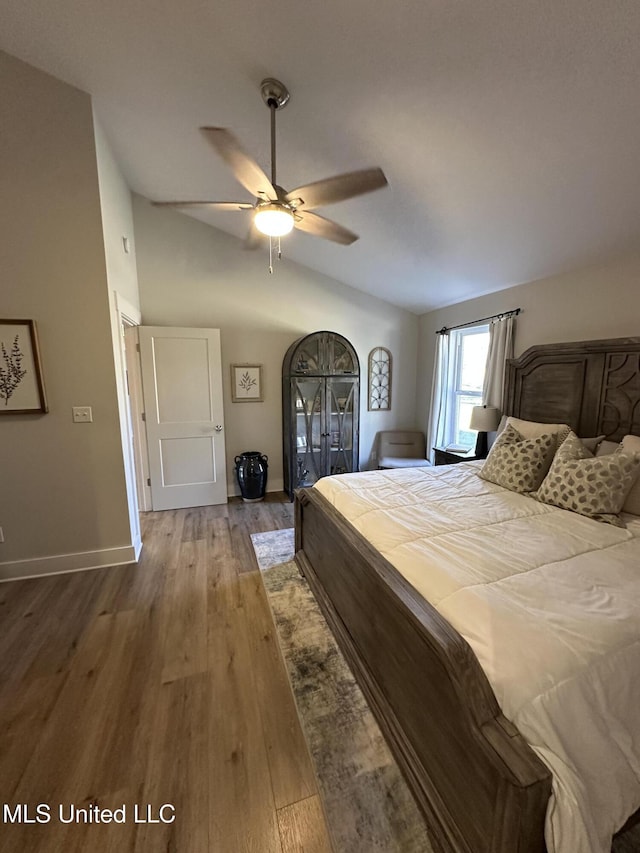 37 Harlan Davis Rd, Lumberton, MS 39455 - bedroom with baseboards, vaulted ceiling, wood finished floors, and ceiling fan