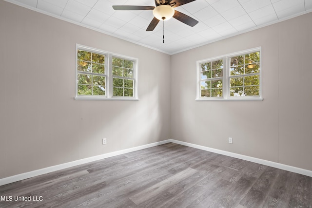 157 Saint Charles Ave, Biloxi, MS 39530 - empty room with a ceiling fan, plenty of natural light, crown molding, and wood finished floors