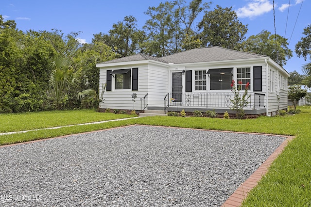 157 Saint Charles Ave, Biloxi, MS 39530 - view of front of home with a front lawn and roof with shingles
