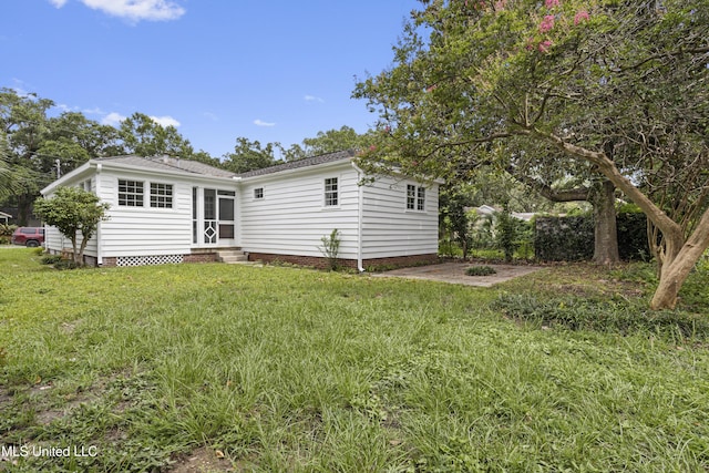 157 Saint Charles Ave, Biloxi, MS 39530 - rear view of property with entry steps, a yard, and roof with shingles