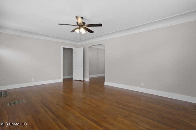 157 Saint Charles Ave, Biloxi, MS 39530 - spare room with a ceiling fan, arched walkways, and dark wood-style flooring