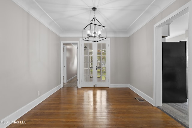 157 Saint Charles Ave, Biloxi, MS 39530 - unfurnished dining area featuring a chandelier, french doors, wood finished floors, and ornamental molding