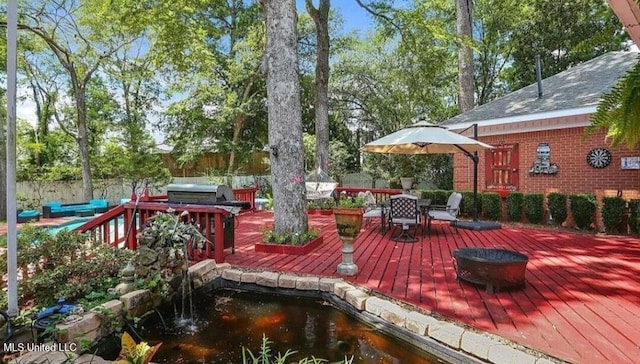47 Avery Cir, Jackson, MS 39211 - deck with a fire pit and outdoor dining space