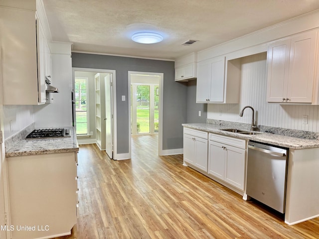 119 Chinquipin Ln, Florence, MS 39073 - kitchen with stainless steel appliances, white cabinetry, light wood finished floors, under cabinet range hood, and ornamental molding