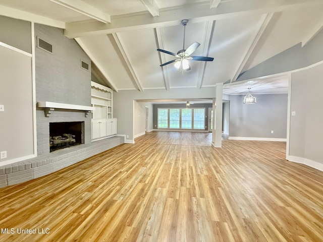 119 Chinquipin Ln, Florence, MS 39073 - unfurnished living room featuring ceiling fan, light wood-type flooring, a brick fireplace, and built in shelves