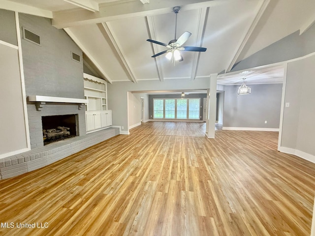 119 Chinquipin Ln, Florence, MS 39073 - unfurnished living room with a ceiling fan, a brick fireplace, light wood-style floors, and built in shelves