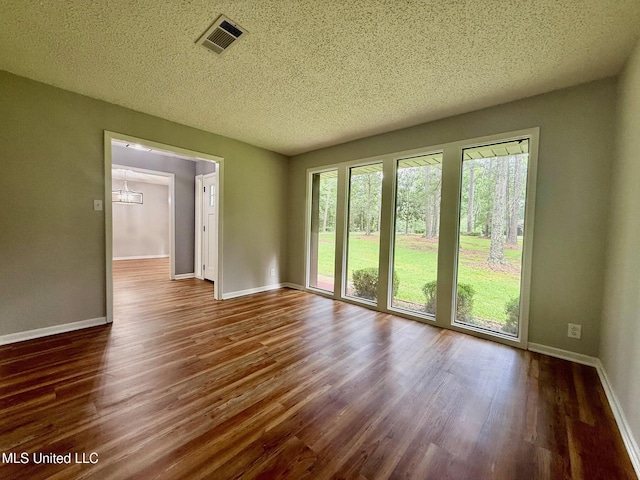 119 Chinquipin Ln, Florence, MS 39073 - empty room with wood finished floors and a textured ceiling