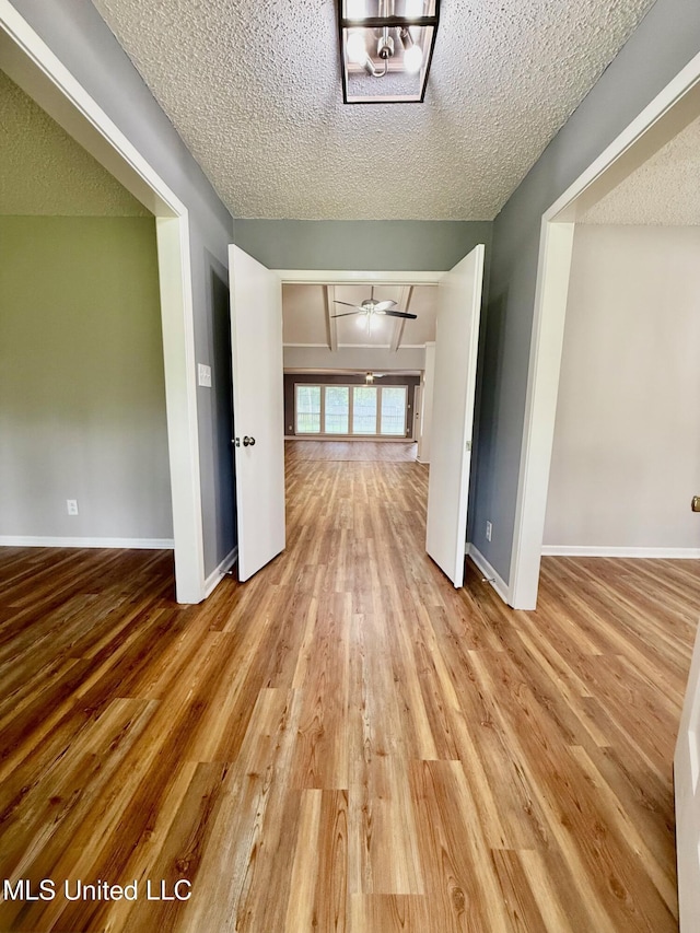 119 Chinquipin Ln, Florence, MS 39073 - empty room with wood finished floors and a textured ceiling