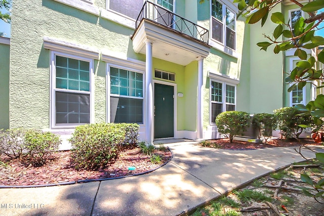 doorway to property with a balcony