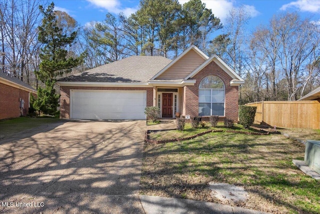 view of front of home featuring a garage and a front lawn