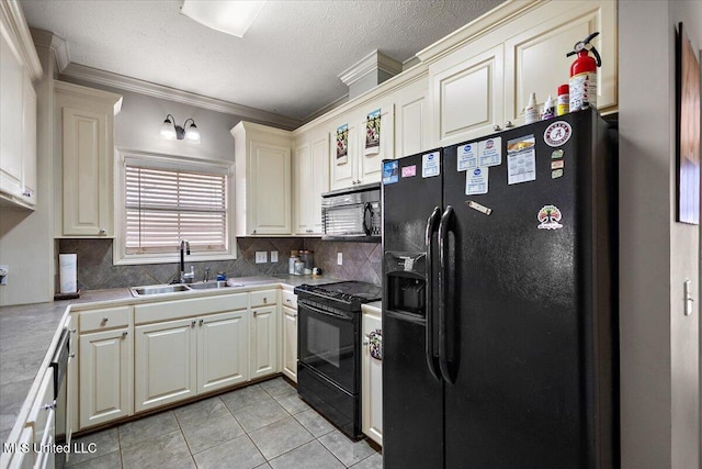 kitchen with sink, backsplash, ornamental molding, black appliances, and light tile patterned flooring