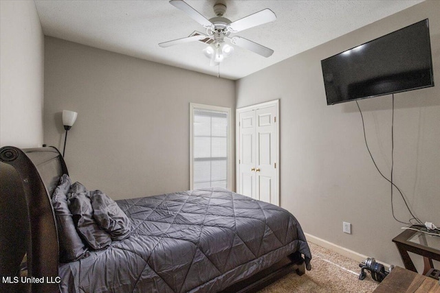 bedroom with ceiling fan and carpet flooring