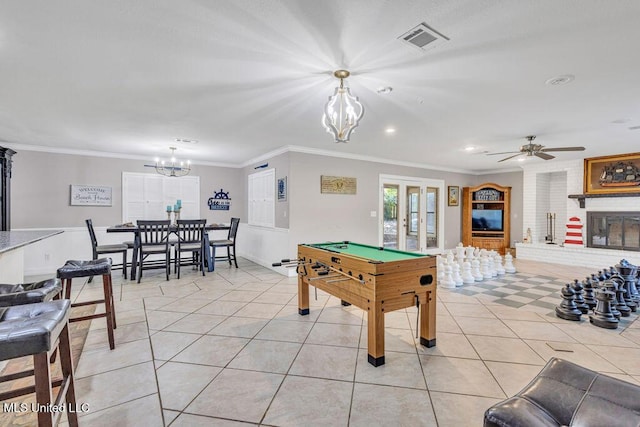 playroom featuring visible vents, light tile patterned flooring, ornamental molding, and french doors