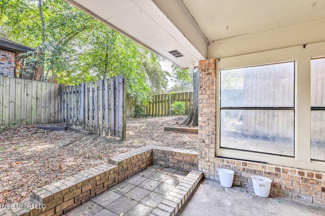 view of patio / terrace featuring visible vents and a fenced backyard