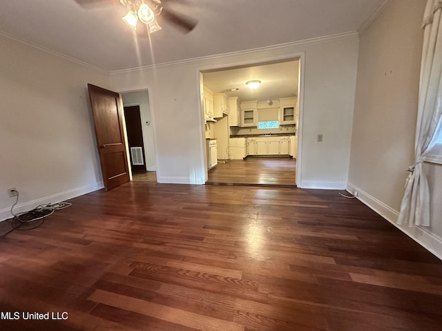 103 Lasalle St, Natchez, MS 39120 - unfurnished living room featuring ceiling fan, dark wood-type flooring, and crown molding