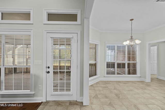 doorway to outside with ornamental molding and a chandelier