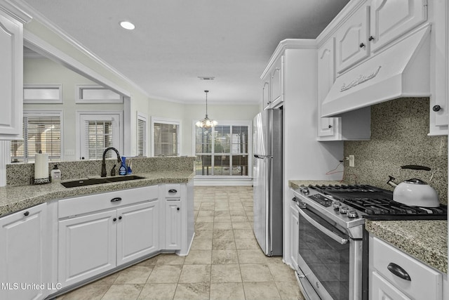 kitchen featuring tasteful backsplash, white cabinetry, sink, stainless steel appliances, and crown molding