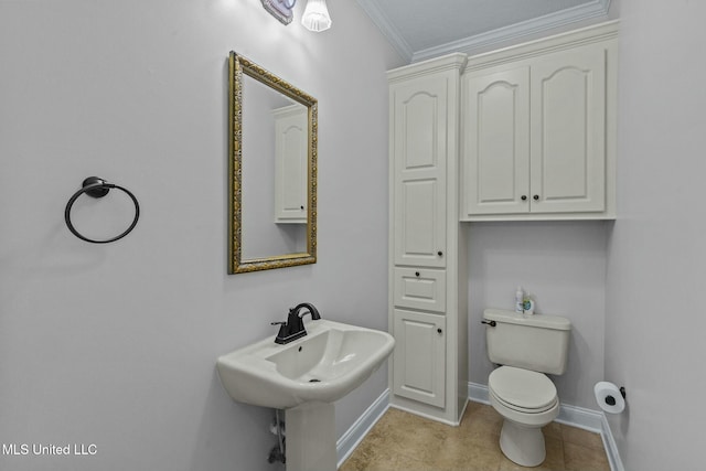 bathroom with ornamental molding and toilet