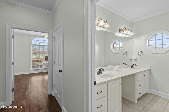 bathroom with vanity, hardwood / wood-style floors, and ornamental molding