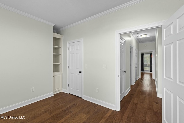 hallway with dark hardwood / wood-style flooring and crown molding