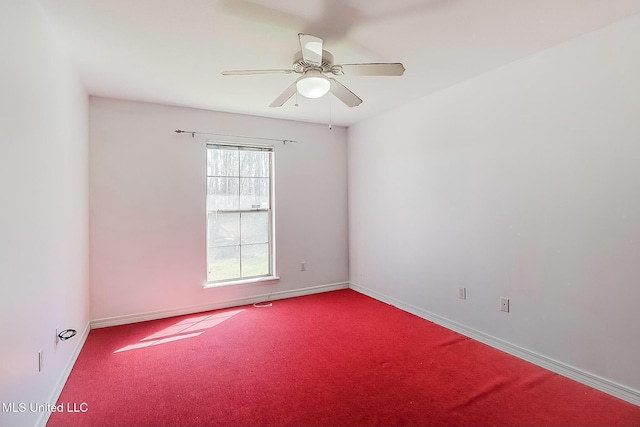 empty room with carpet floors, ceiling fan, and baseboards