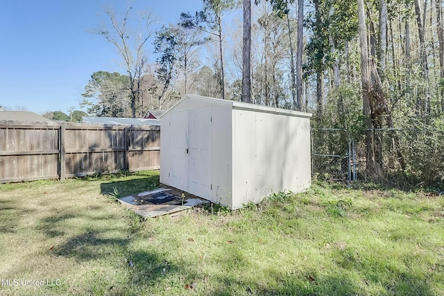 view of shed featuring fence