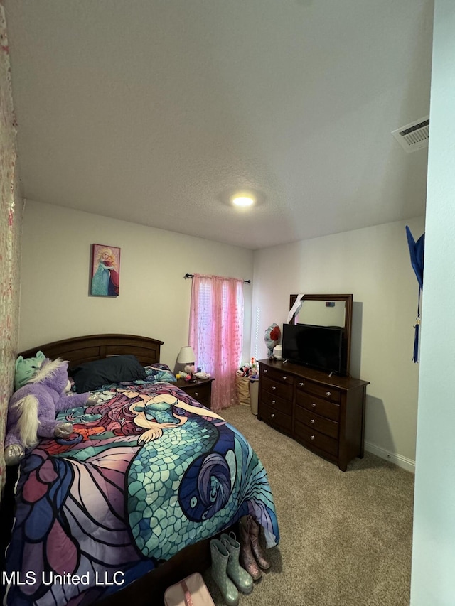 bedroom with light colored carpet