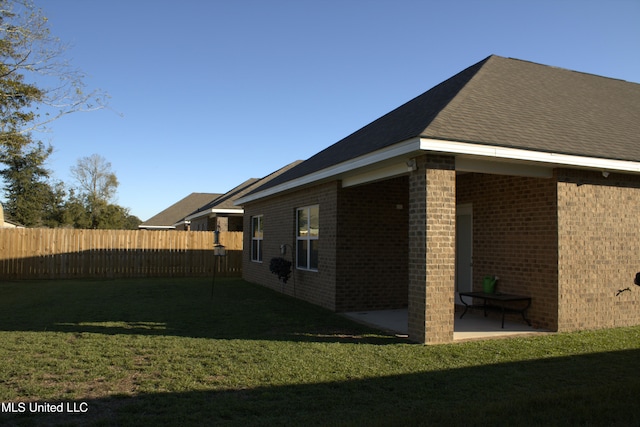 exterior space featuring a yard and a patio