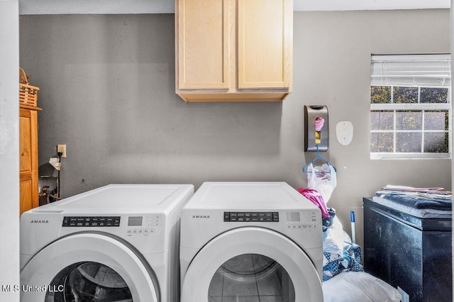 laundry area with cabinets and independent washer and dryer