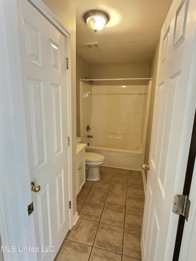 1204 Dorothy St, Ocean Springs, MS 39564 - bathroom featuring toilet, tile patterned flooring,  shower combination, and vanity