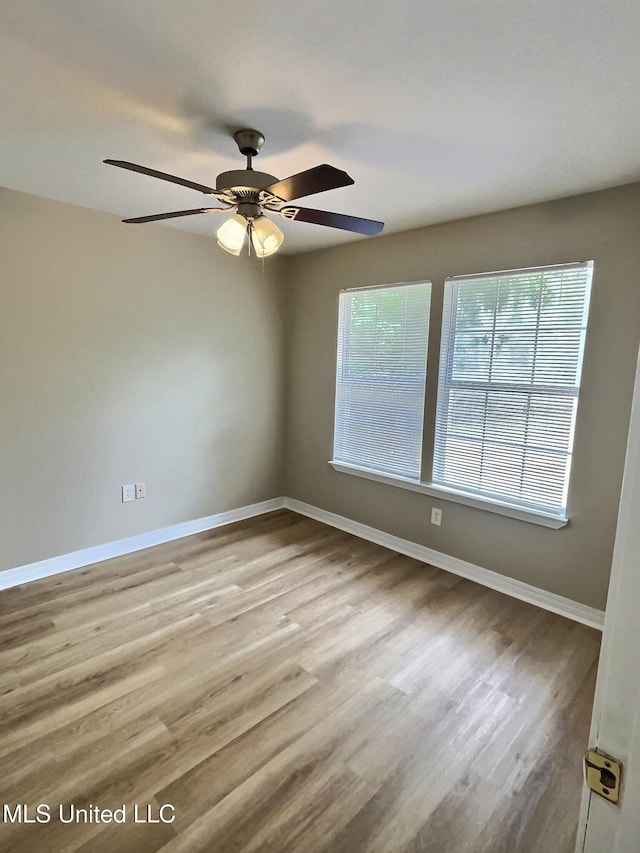 1204 Dorothy St, Ocean Springs, MS 39564 - unfurnished room featuring baseboards, a ceiling fan, and wood finished floors
