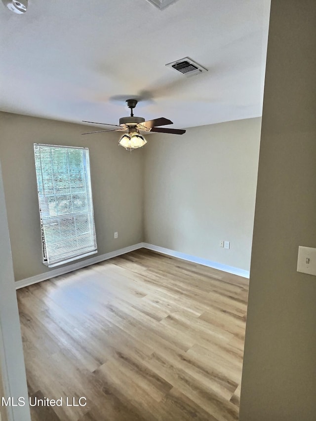 1204 Dorothy St, Ocean Springs, MS 39564 - spare room with wood finished floors, baseboards, and ceiling fan