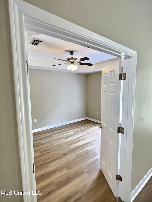 1204 Dorothy St, Ocean Springs, MS 39564 - unfurnished room with ceiling fan, wood finished floors, and baseboards