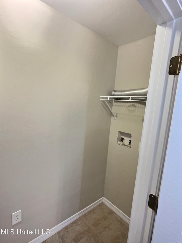1204 Dorothy St, Ocean Springs, MS 39564 - laundry room with hookup for a washing machine and baseboards