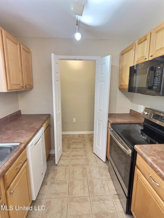 1204 Dorothy St, Ocean Springs, MS 39564 - kitchen featuring stainless steel electric range, black microwave, white dishwasher, light brown cabinetry, and light tile patterned flooring