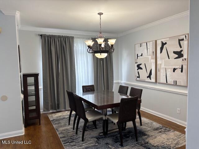 220 Forked Creek Pkwy, Hernando, MS 38632 - dining room featuring a chandelier, dark wood finished floors, ornamental molding, and baseboards