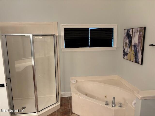 220 Forked Creek Pkwy, Hernando, MS 38632 - bathroom with a shower stall, a tub with jets, tile patterned flooring, and baseboards