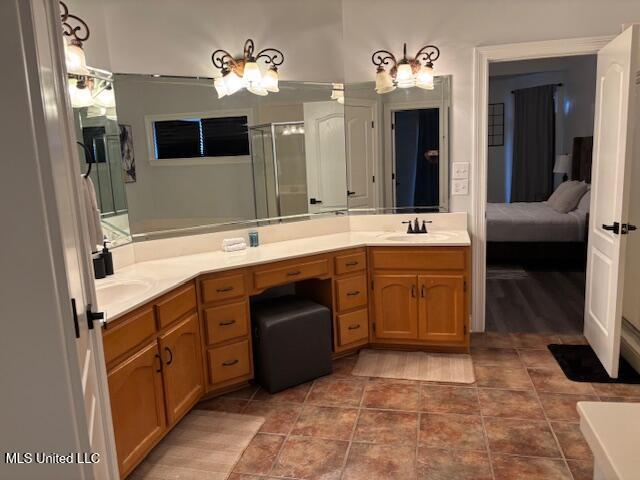 220 Forked Creek Pkwy, Hernando, MS 38632 - bathroom with double vanity, ensuite bathroom, tile patterned floors, and an enclosed shower