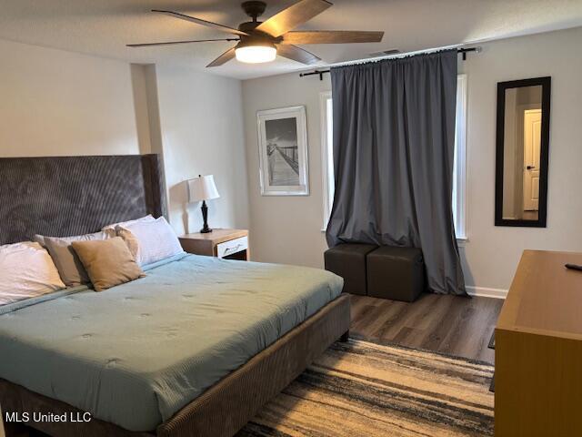 220 Forked Creek Pkwy, Hernando, MS 38632 - bedroom with wood finished floors, baseboards, and a ceiling fan