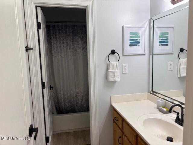 220 Forked Creek Pkwy, Hernando, MS 38632 - bathroom with vanity, wood finished floors, and shower / tub combo with curtain